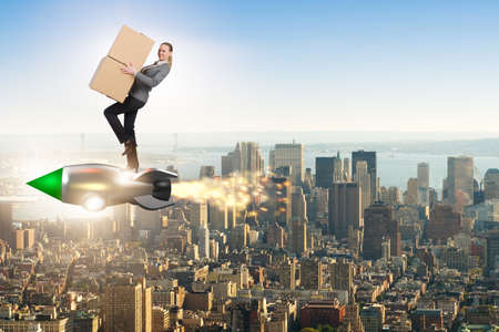 Woman flying rocket and delivering boxesの写真素材