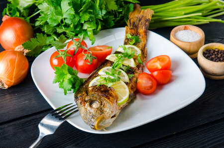 Fried fish served on the plate