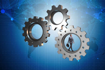 Teamwork concept with cogwheels and business peopleの写真素材