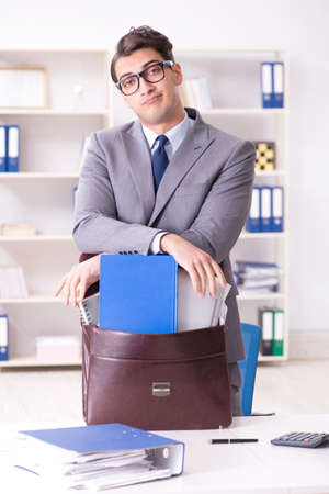 Employee with too much work taking it homeの写真素材