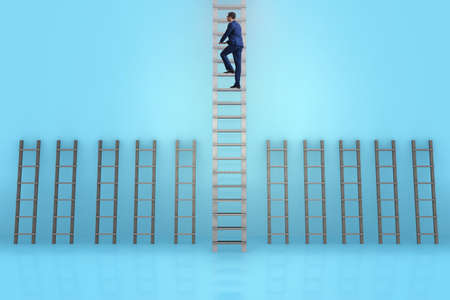 Businessman climbing career ladder in business success conceptの写真素材