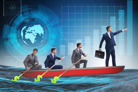 Team of businessmen in teamwork concept with boatの写真素材