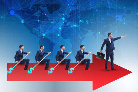 Team of businessmen in teamwork concept with boatの写真素材