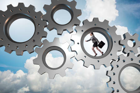 Teamwork concept with cogwheels and business peopleの写真素材