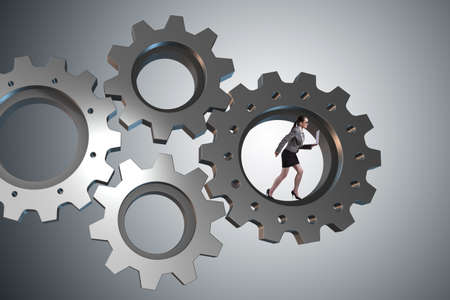 Teamwork concept with cogwheels and business peopleの写真素材