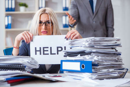 Angry boss yelling at his assistant secretaryの写真素材