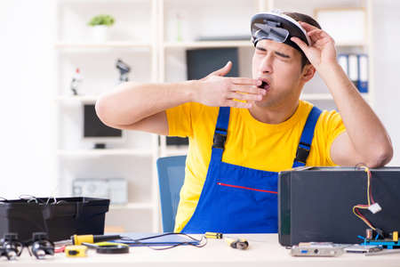 Computer repair technician repairing hardwareの写真素材