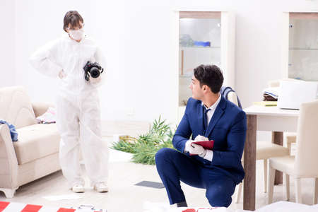 Forensics investigator at the scene of office crimeの写真素材