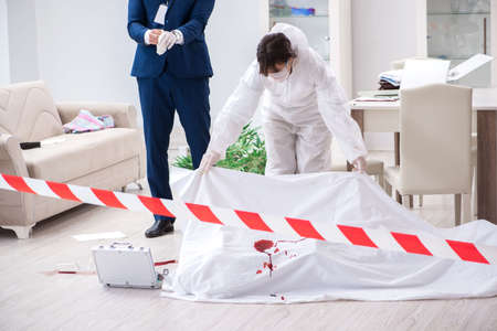 Forensics investigator at the scene of office crimeの写真素材