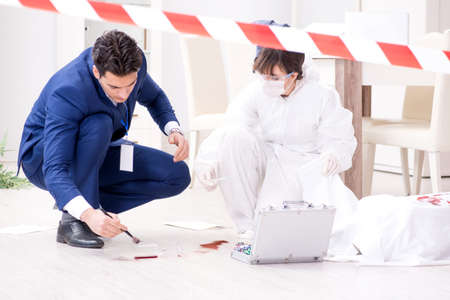 Forensics investigator at the scene of office crimeの写真素材