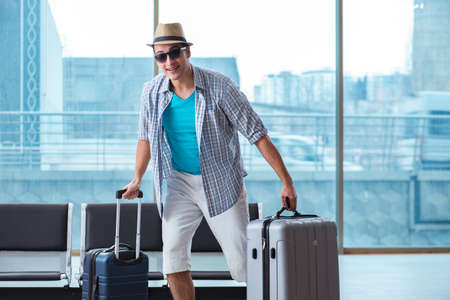 Young man travelling for his summer beach vacationの写真素材