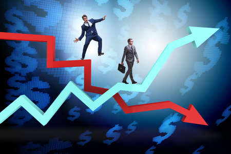 Opposite growth and decliine charts with businessmanの写真素材