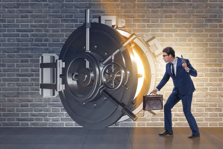 Man with gun stealing money from bankの写真素材