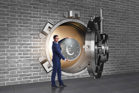 Businessman depositing european euro to bankの写真素材