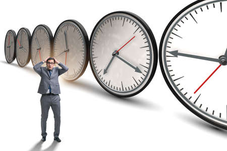 Businessman in time management conceptの写真素材