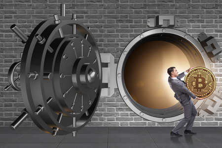 Man stealing bitcoin from bankの写真素材