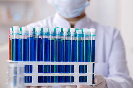 Woman chemist working in hospital clinic lab