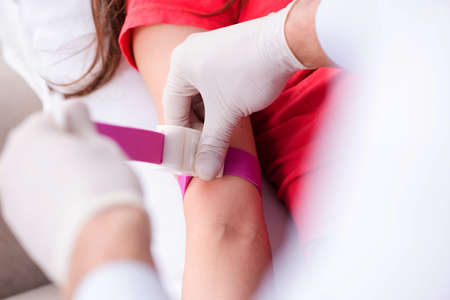 Pregnant woman patient visiting doctor for regular check-upの写真素材