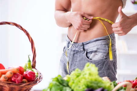 Young man in healthy eating and dieting conceptの写真素材