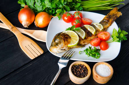 Fried fish served on the plateの写真素材