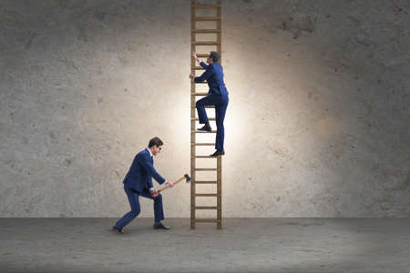 Business unethical competition concept with businessmenの写真素材