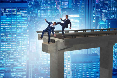 Business unethical competition concept with businessmenの写真素材