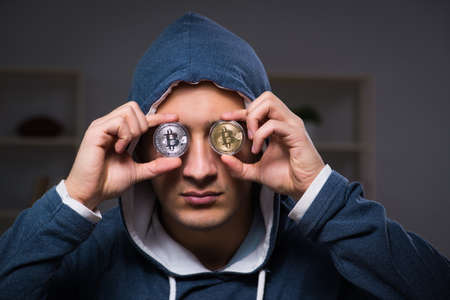 Young man in bitcoin mining conceptの写真素材