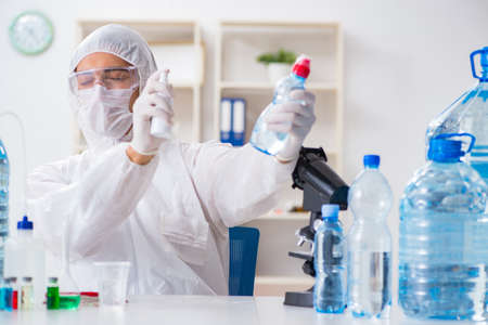 Lab assistant testing water quality