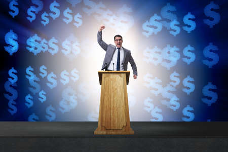 Man businessman making speech at rostrum in business conceptの写真素材