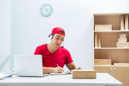 Call center worker at parcel distribution center in post office