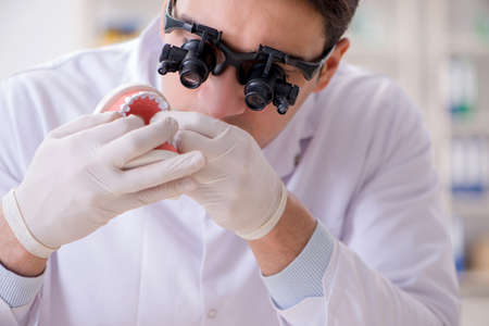 Young dentist working in the dentistry hospitalの写真素材