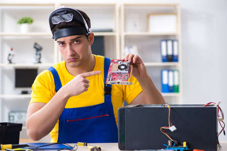 Computer repair technician repairing hardware