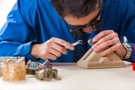 Jeweler working with luxury jewelry in the workshop