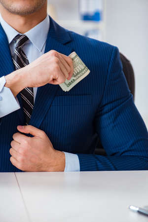 Businessman receiving his salary and bonusの写真素材