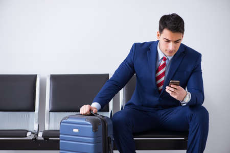 Man wairing to boarding in airport lounge roomの写真素材