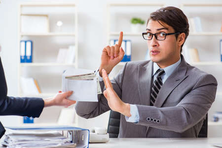 Businessmanbeing offered bribe for breaking lawの写真素材