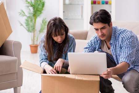 Young family moving in to new apartment after paying off mortgageの写真素材