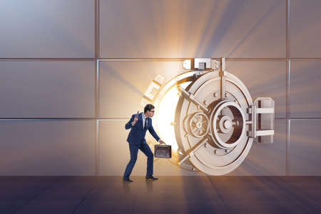 Man with gun stealing money from bankの写真素材