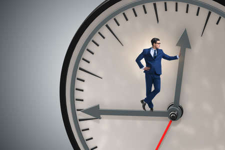 Businessman in time management conceptの写真素材
