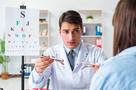 Doctor with patient at eye exam