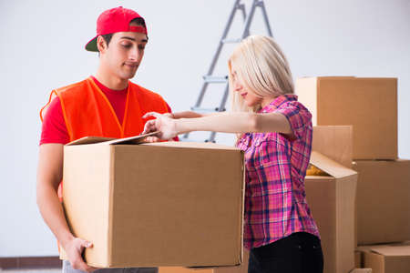 Young delivery assistant delivering to home