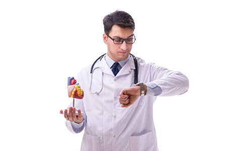 Young doctor with heart shape isolated on whiteの写真素材