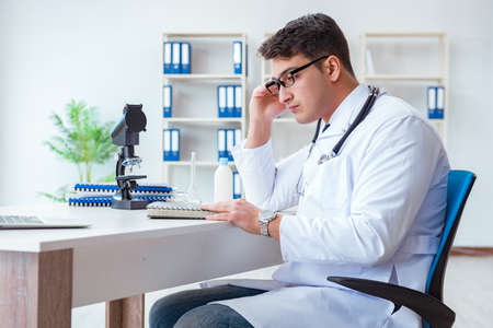 Tired doctor after night shiftの写真素材