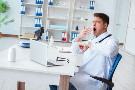 Tired doctor after night shiftの写真素材