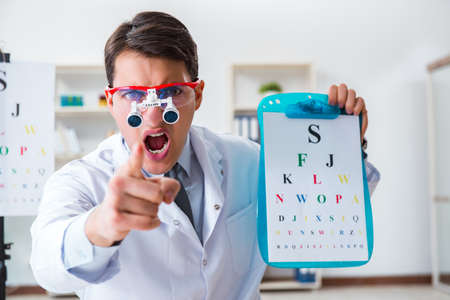 Eye doctor in eyecare concept in hospitalの写真素材