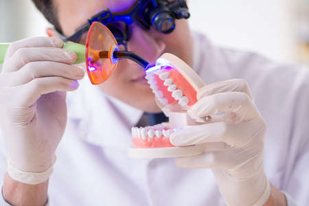 Young dentist working in the dentistry hospitalの写真素材