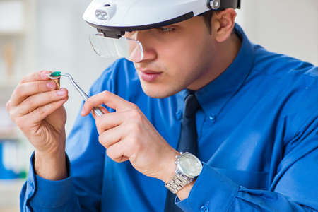 Jeweler working with luxury jewelry in the workshop
