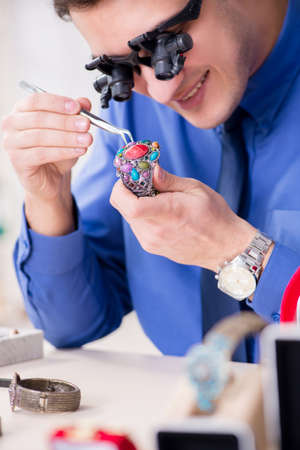 Jeweler working with luxury jewelry in the workshop
