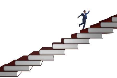 Businessman student climbing the ladder of education booksの写真素材