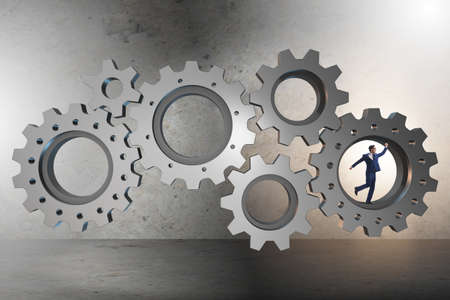 Teamwork concept with cogwheels and business peopleの写真素材